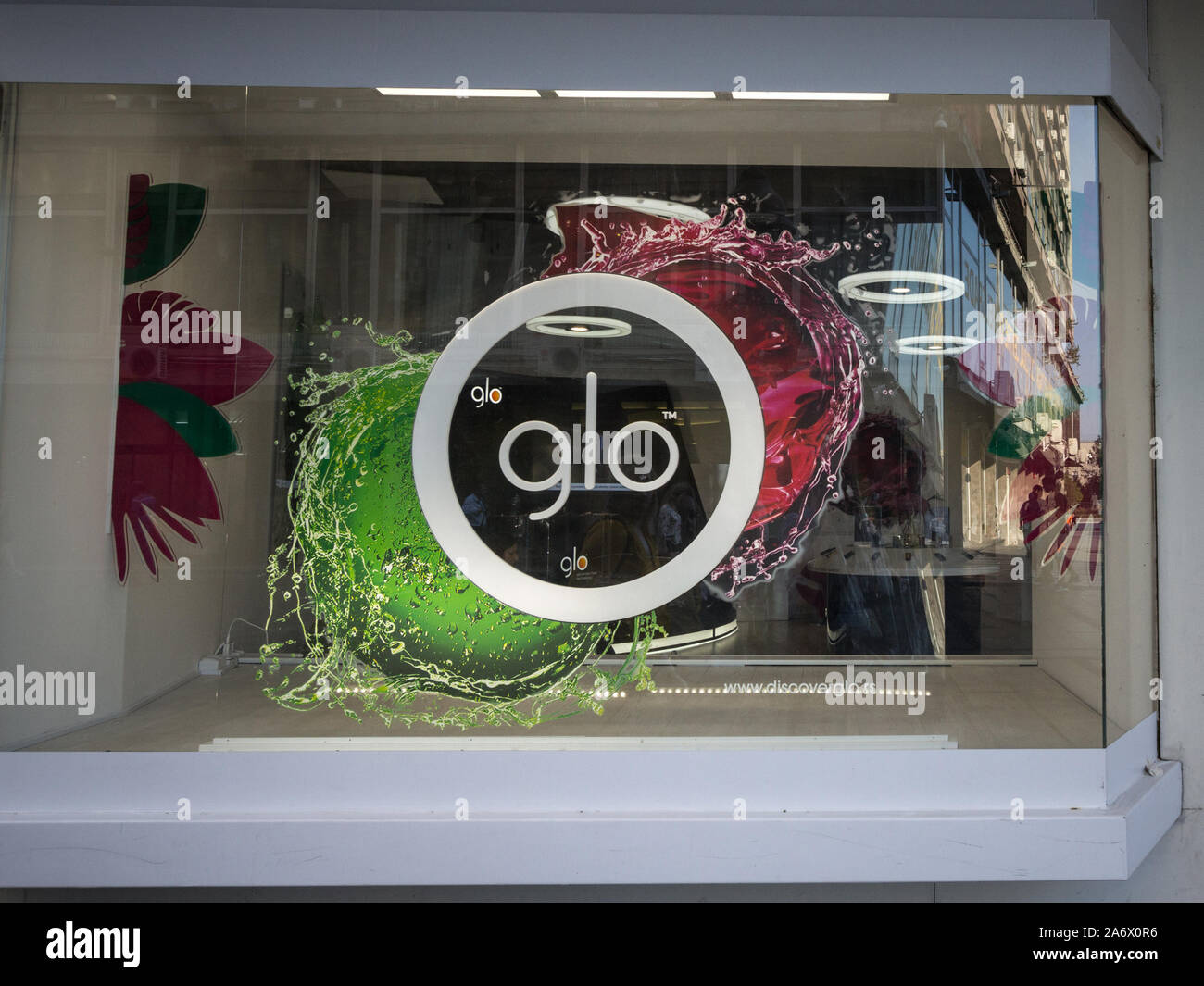 BELGRADE, SERBIA - JULY 6, 2019: Glo logo in front of a local shop in Serbia. Glo, beloning to British American Tobacco is a tobacco heating cigarette Stock Photo