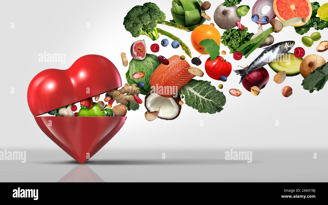Healthy food concept and nutritional ingredients for heart health with fruit vegetables nuts fish and beans as a natural diet. Stock Photo