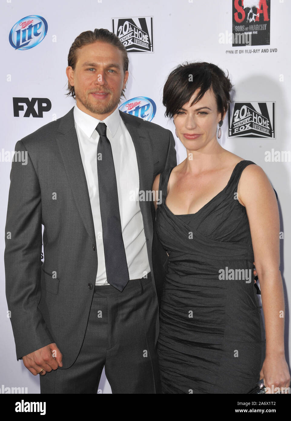 LOS ANGELES, CA. September 07, 2013: Charlie Hunnam & Maggie Siff at the season 6 premiere of 'Sons of Anarchy' at the Dolby Theatre, Hollywood. © 2013 Paul Smith / Featureflash Stock Photo
