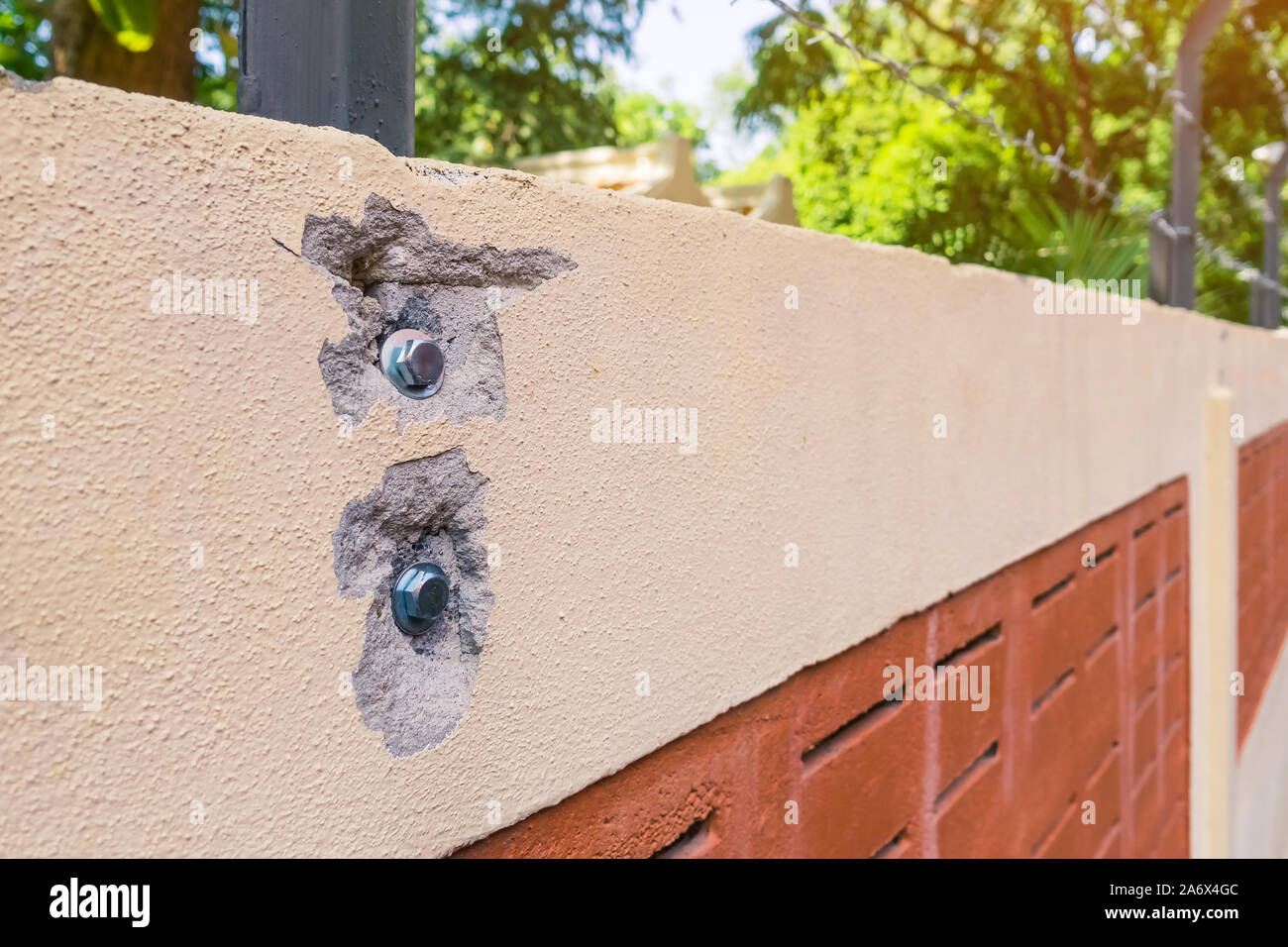 Broken on concrete walls after drilling and fixing bolt with nut and