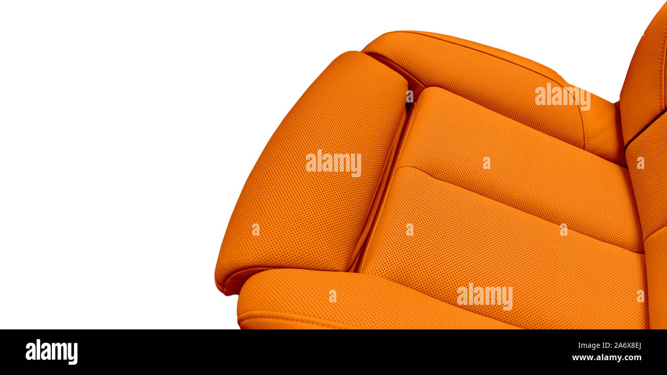 Orange leather interior of the luxury modern car. Perforated brown leather comfortable seats with stitching isolated on white background. Modern car i Stock Photo