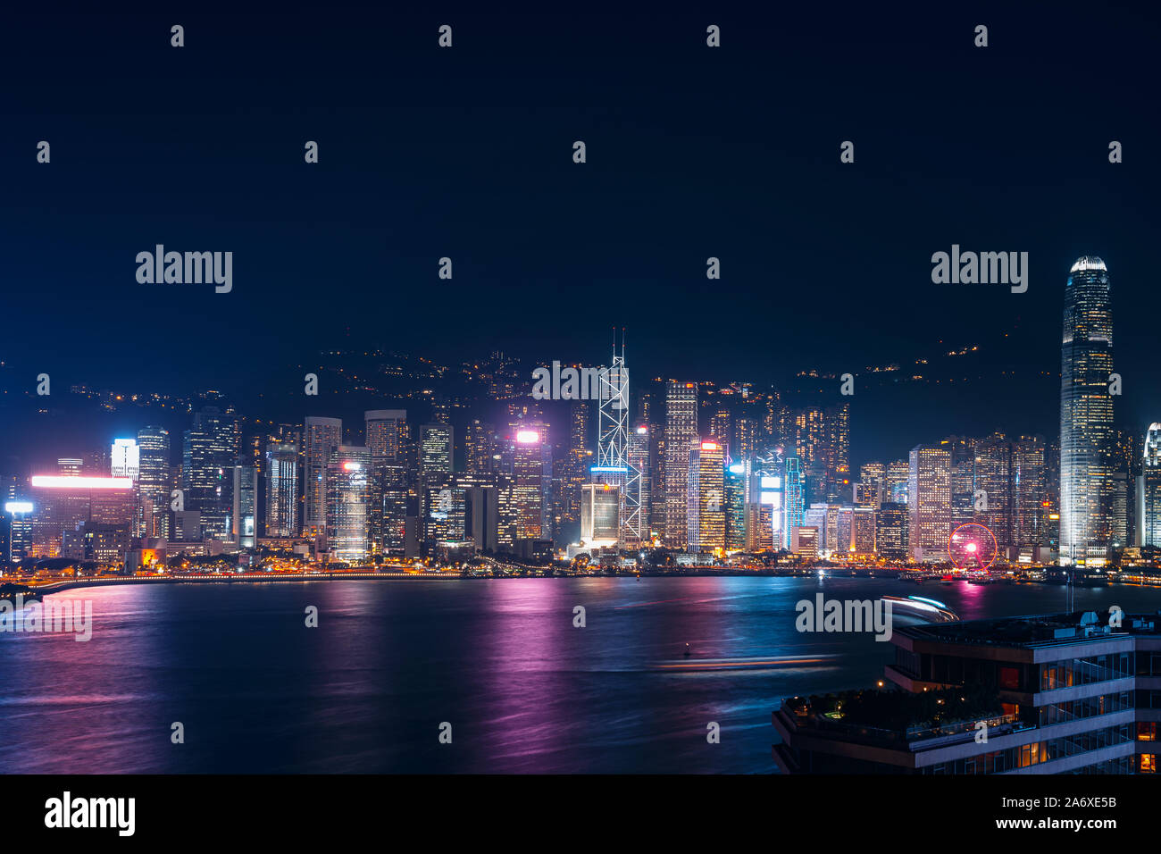Cityscape and skyline at Victoria Harbour in Hong Kong city at Night ...