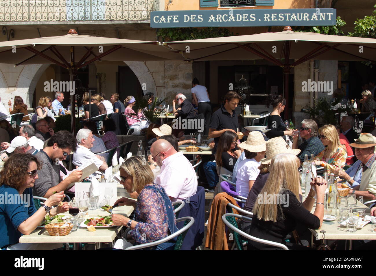 Busy restaurant at lunchtime in the market square of Valbonne, Riviera, Provence, France Stock Photo