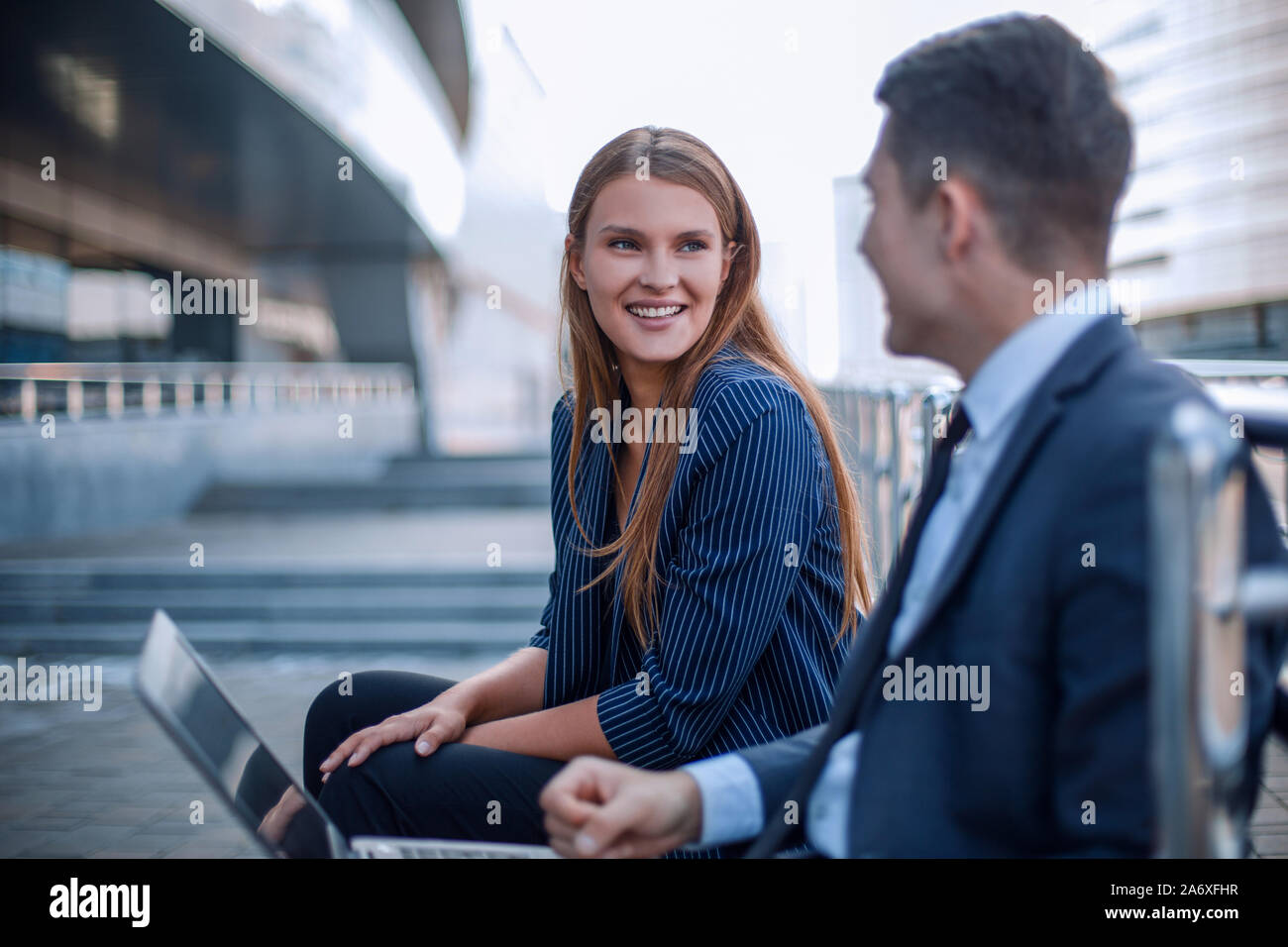 Summer business people man woman sitting on bench hi-res stock ...