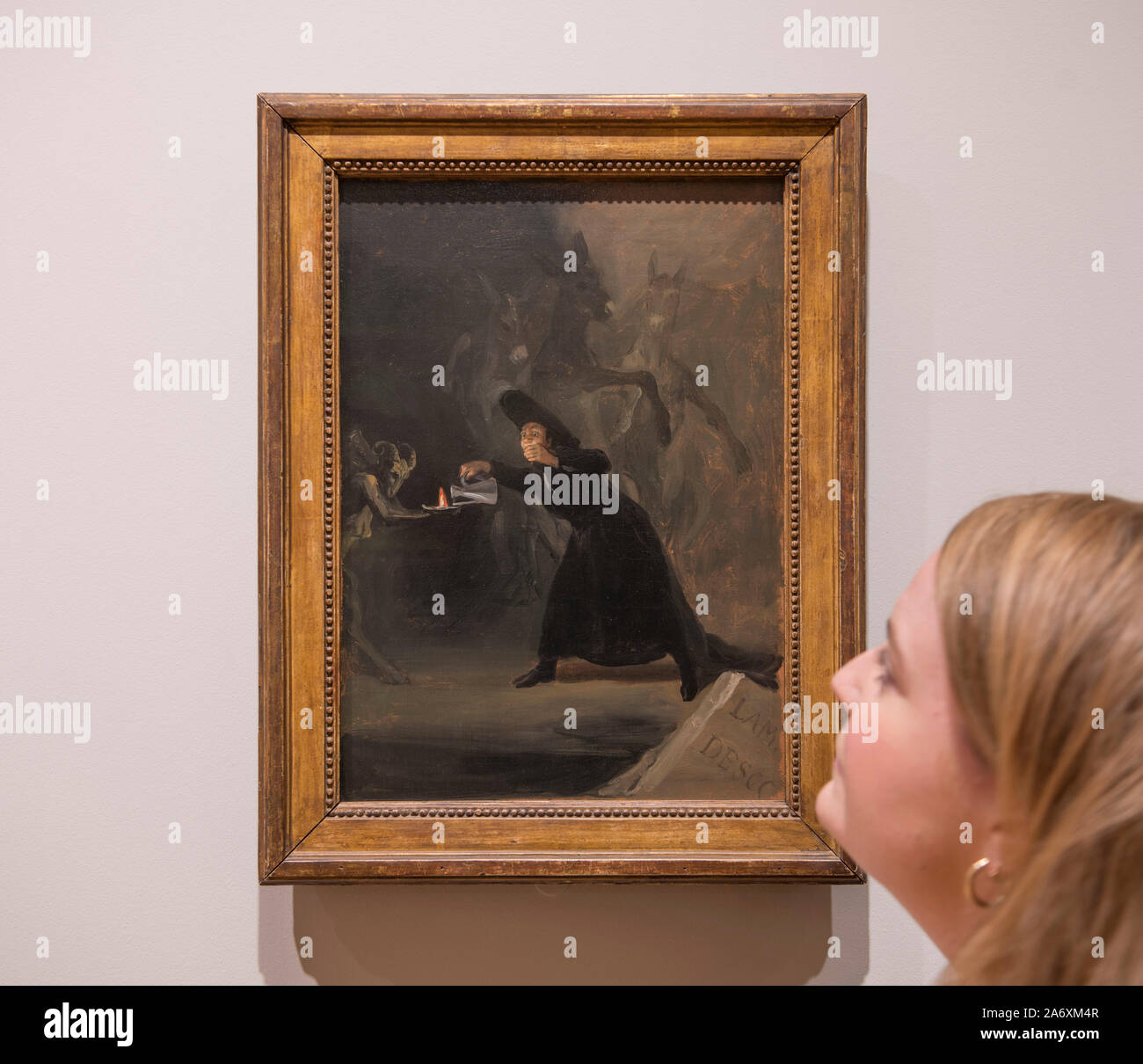 National Gallery, London, UK. 17th October 2019.  Photo embargoed until 29th October 2019. The National Gallery choose two pictures with a spooky horror Halloween theme for the 31st October, posed with members of staff. Image: A Scene from ‘The Forcibly Bewitched’. Francisco de Goya, 1798. The National Gallery, London. Credit: Malcolm Park/Alamy Live News. Stock Photo