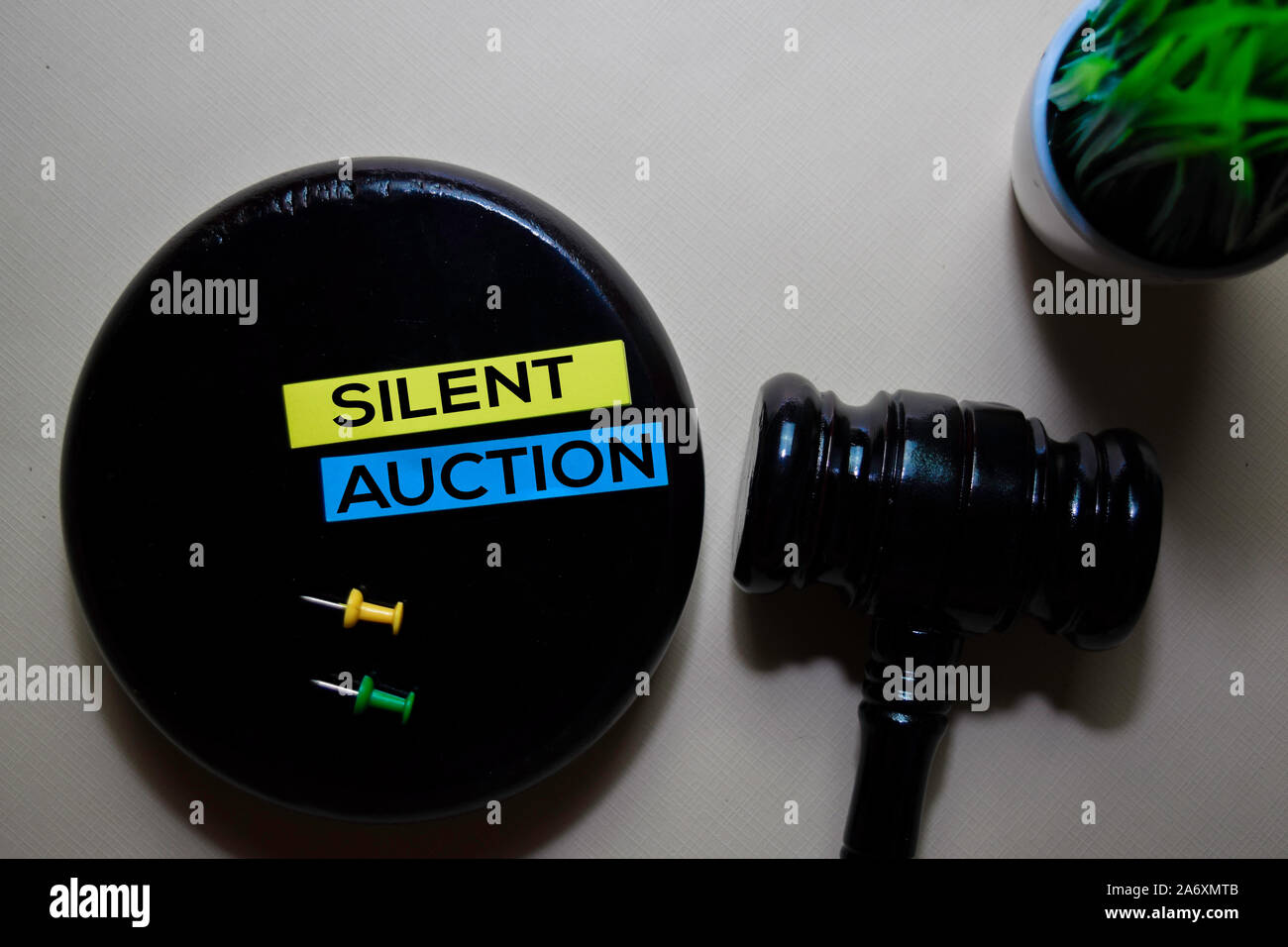 Silent Auction text on sticky notes and gavel isolated on office desk.  Justice law concept Stock Photo - Alamy