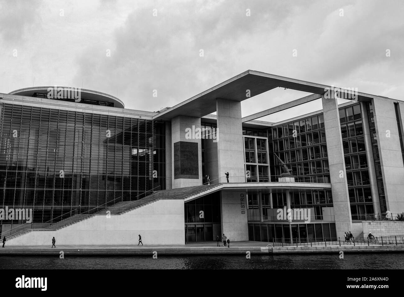 Famous Modern architecture with people tourists walking in berlin city center,BW Stock Photo