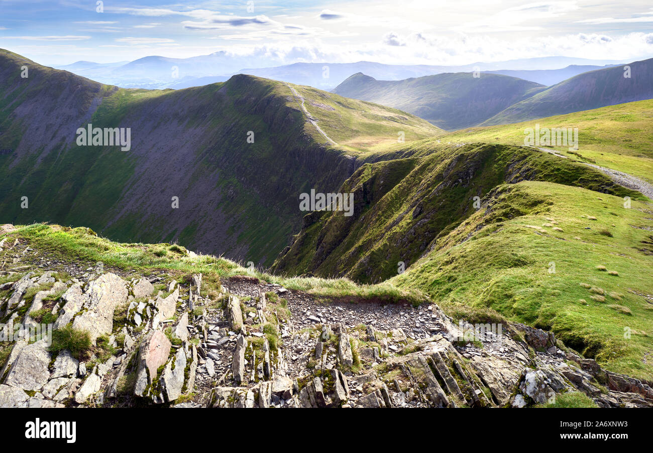 The rocky crags of Hobcarton leading to Grisedale Pike from gthe summits of Hopegill Head in the Lake District, England, UK. Stock Photo