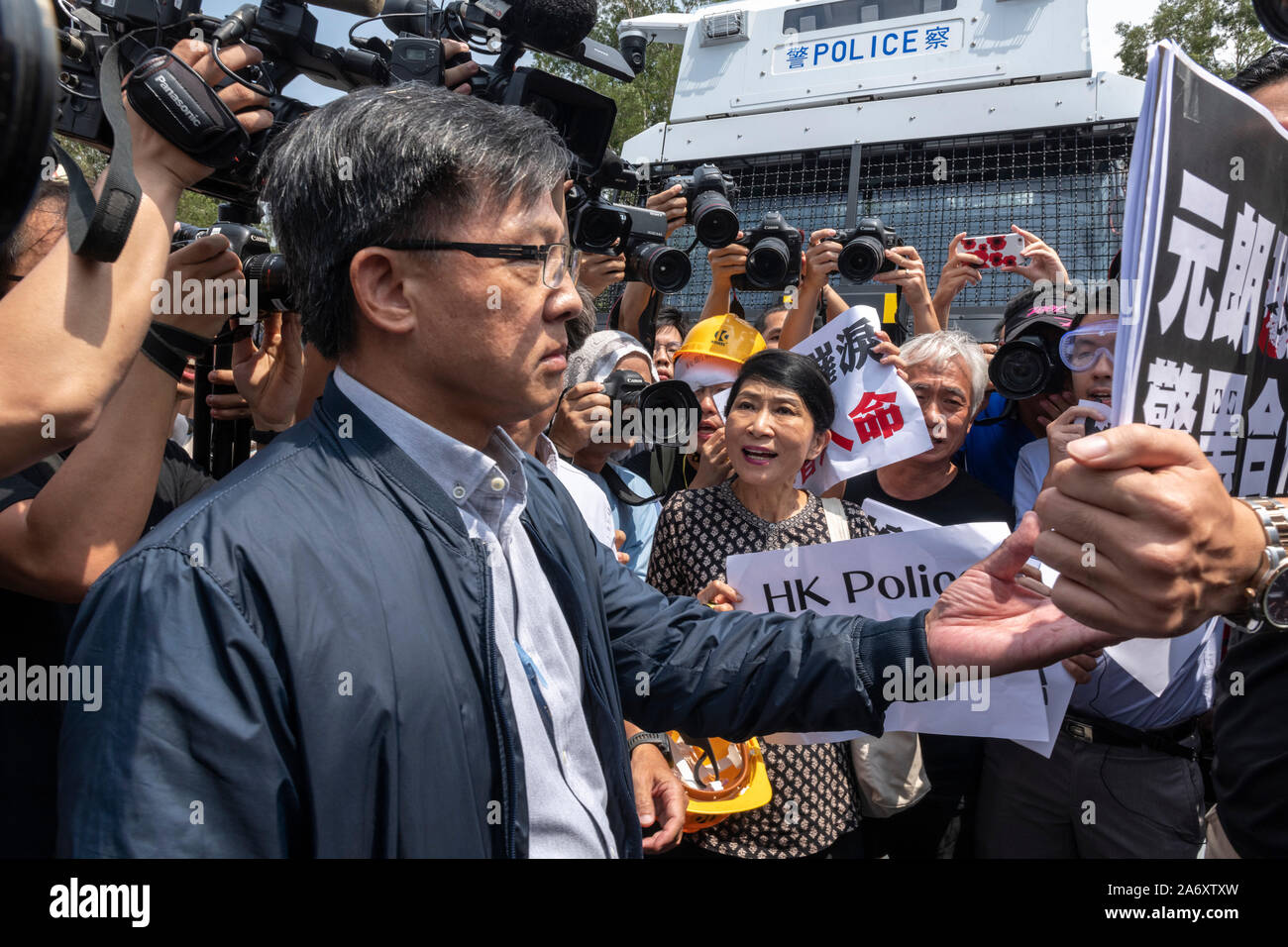 Pro-Beijing lawmaker Junius Ho Kwan-yiu (L) has been stripped of an honorary law degree by his alma mater, Anglia Ruskin University Cambridge, for sha Stock Photo