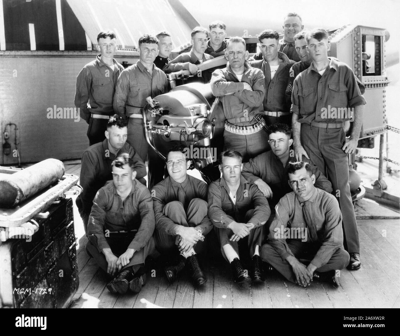 LON CHANEY and WILLIAM HAINES with U.S. Marines candid during filming on Battleship U.S.S.CALIFORNIA of TELL IT TO THE MARINES 1926 director George W. Hill Silent movie with the Co-operation and Endorsement of the U.S. Marine Corps Metro Goldwyn Mayer Stock Photo