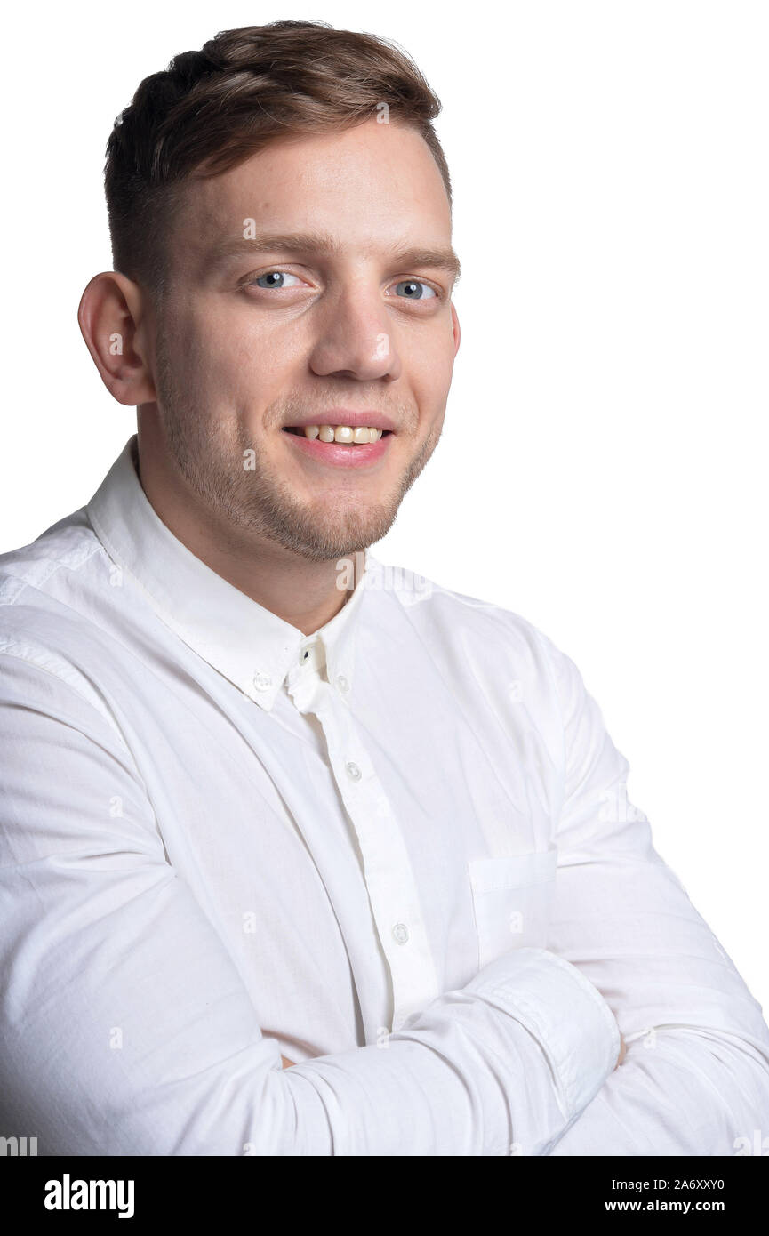 Portrait of handsome young man wearing white shirt isolated on white ...