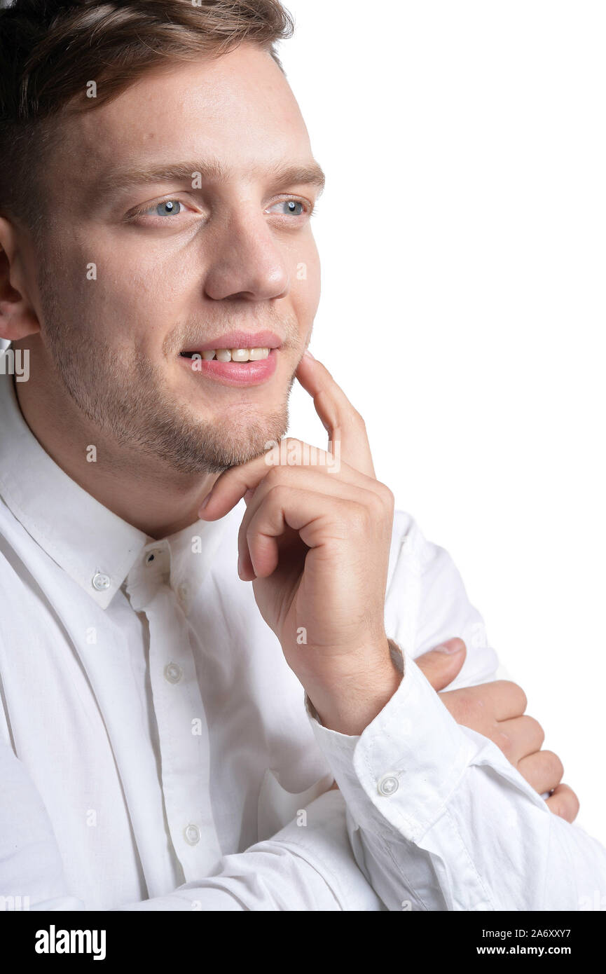 Portrait of handsome young man wearing white shirt isolated on white ...