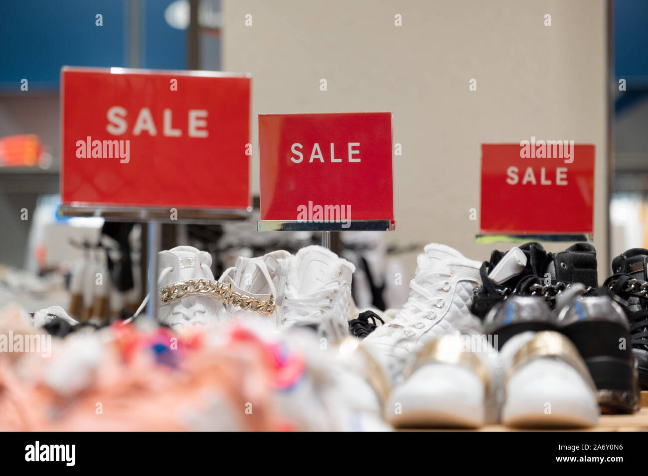 signs advertising sale of shoes at reduced price Stock Photo