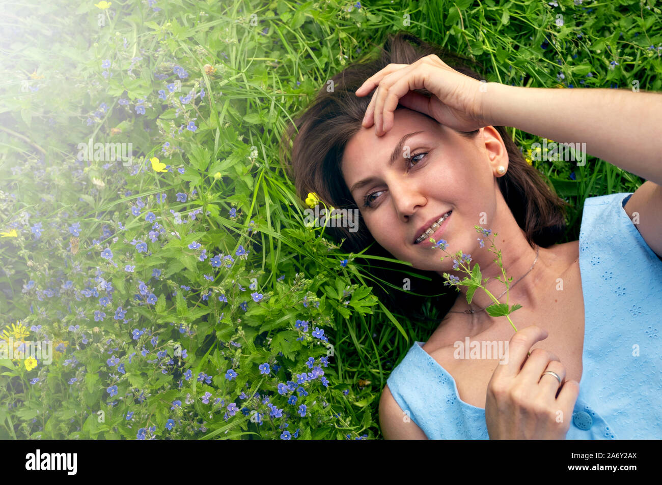 portrait of a girl resting in nature on the grass Stock Photo