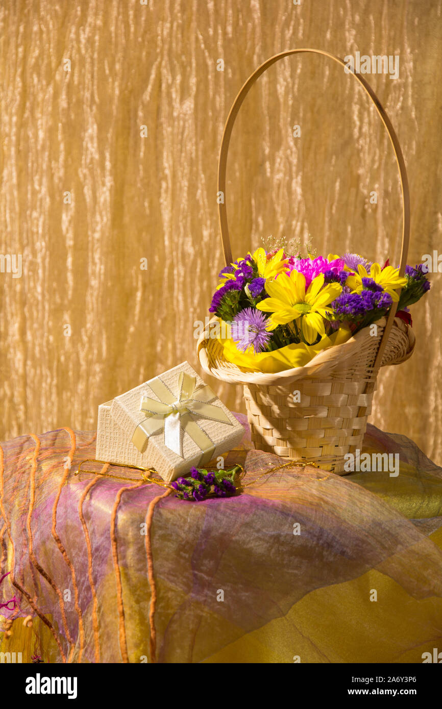 Still life with colorful fresh flowers in a basket Stock Photo - Alamy