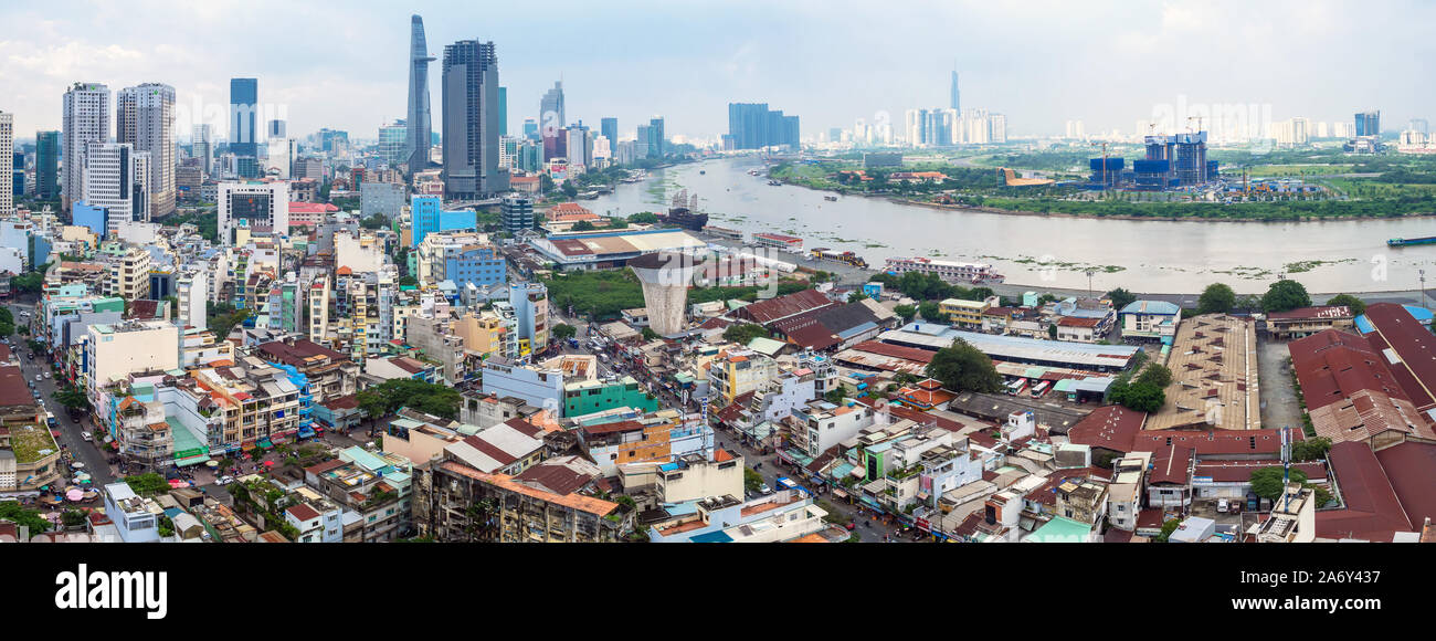 HO CHI MINH, VIETNAM - September 23 2019 : Panorama view of ho chi minh city and Saigon river from District 4 with development buildings, transportati Stock Photo
