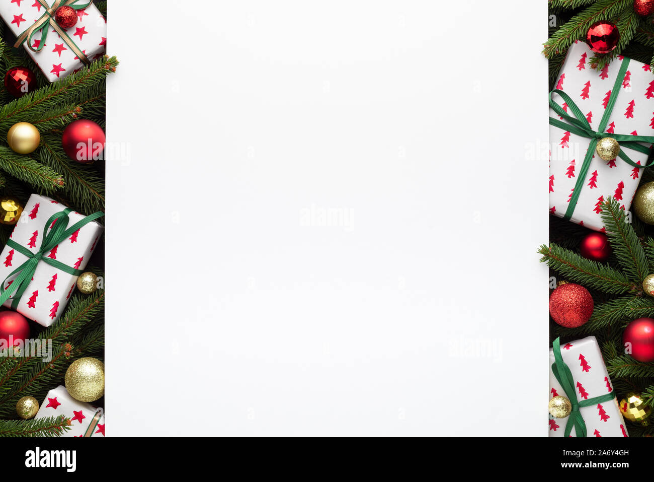 Decorative border of fir branches, gift boxes and Christmas balls ...