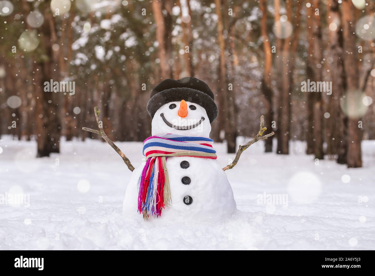 Cute frost ice snowman in winter snow background. Christmas theme