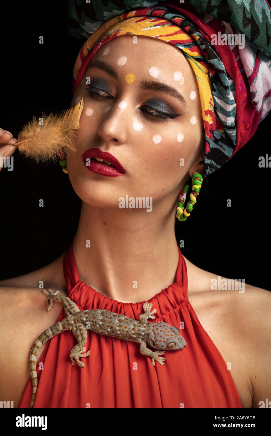 portrait with a bird feather in her face Stock Photo