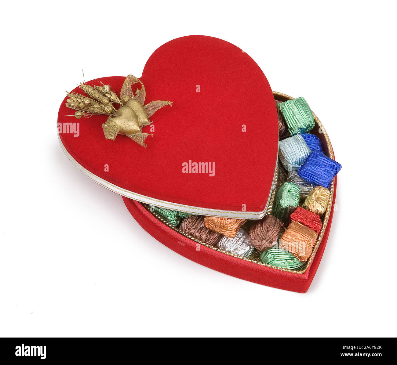Colourful chocolates in heart shaped box, isolated on white background Stock Photo