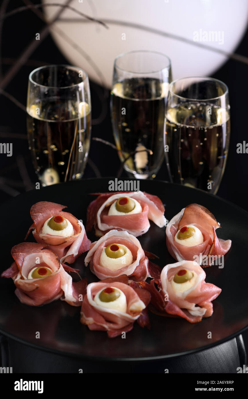Original Halloween snacks. Eyeballs cooked from ham with mozzarella ...