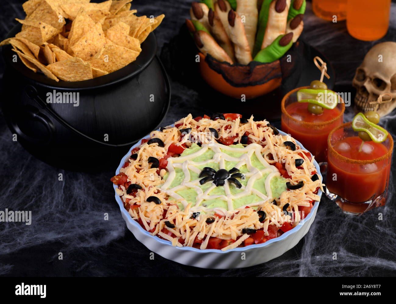 Spooky Halloween Seven Layer Taco Dip Turn a classic appetizer into a