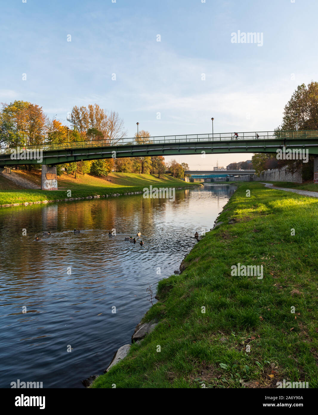 Ostravice river with bridges above and colorful trees around in Ostrava city in Czech republic during nice autumn day Stock Photo
