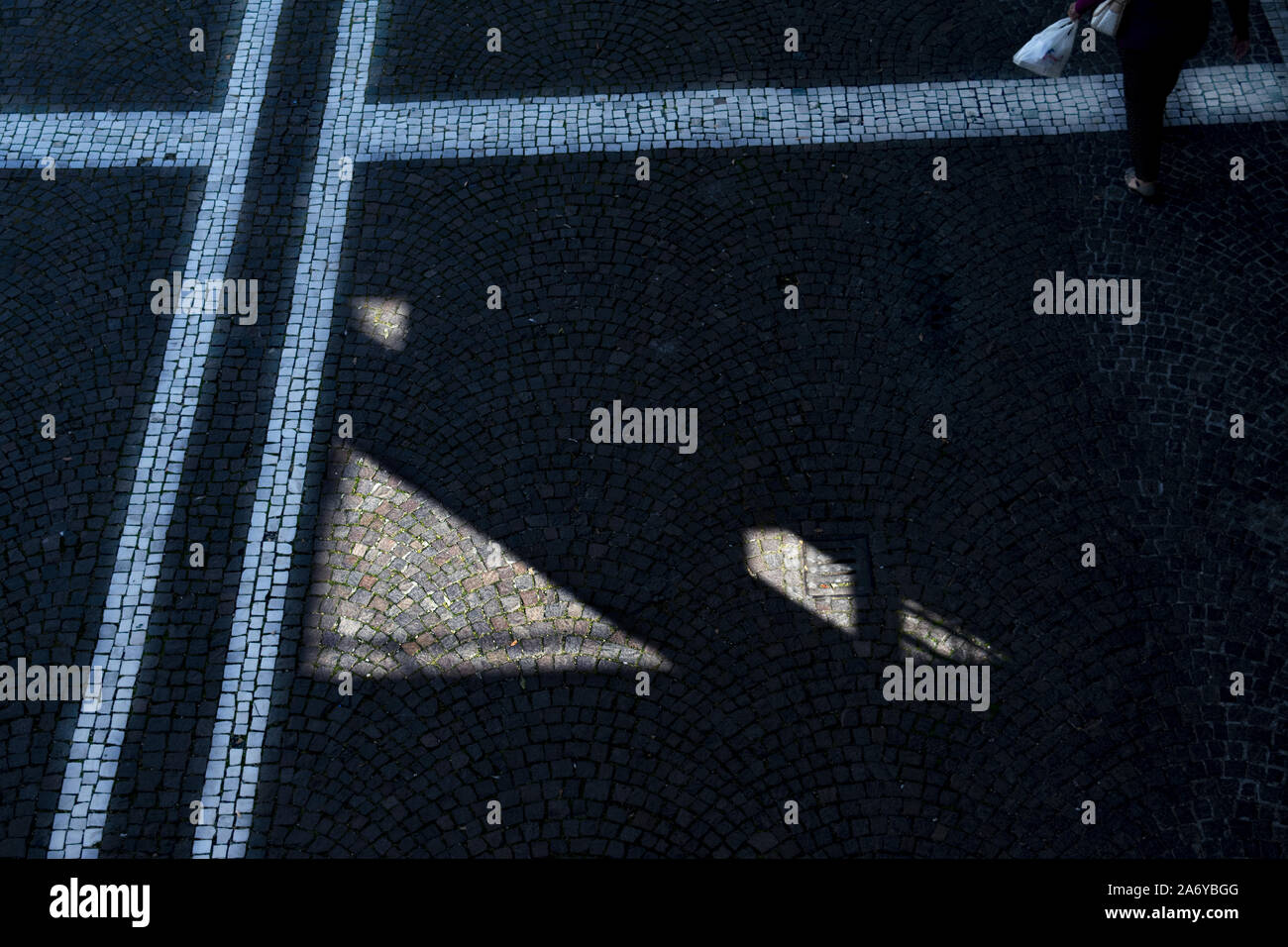 lines and geometries on a paved of a street Stock Photo