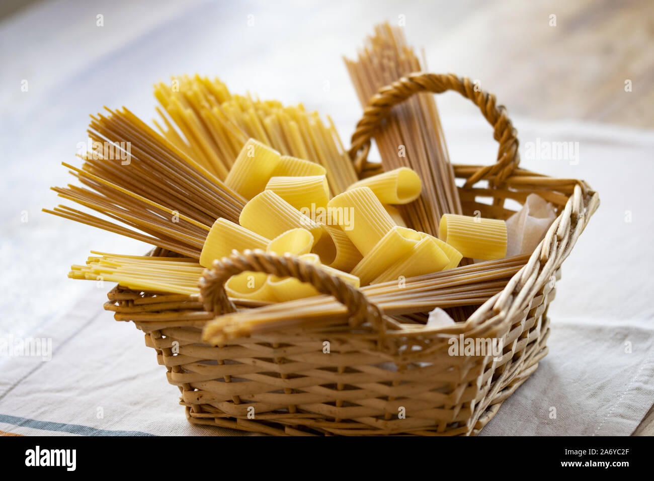 variety of both wholegrain and normal pasta types in a wicker basket Stock Photo Alamy