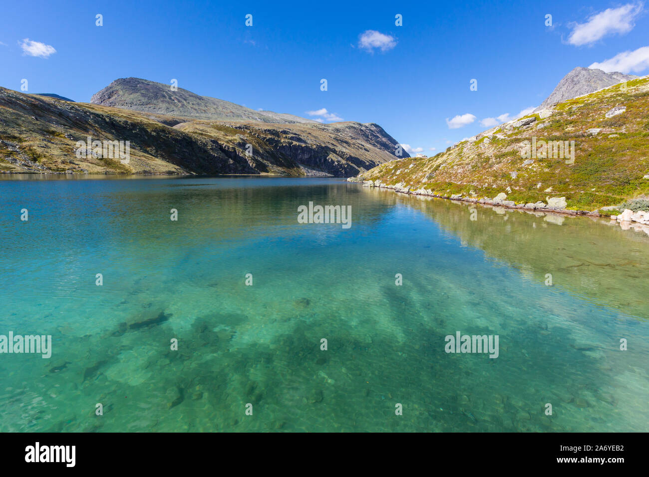 clear green water of lake Rondvatnet in Rondane National Park in Norway Stock Photo