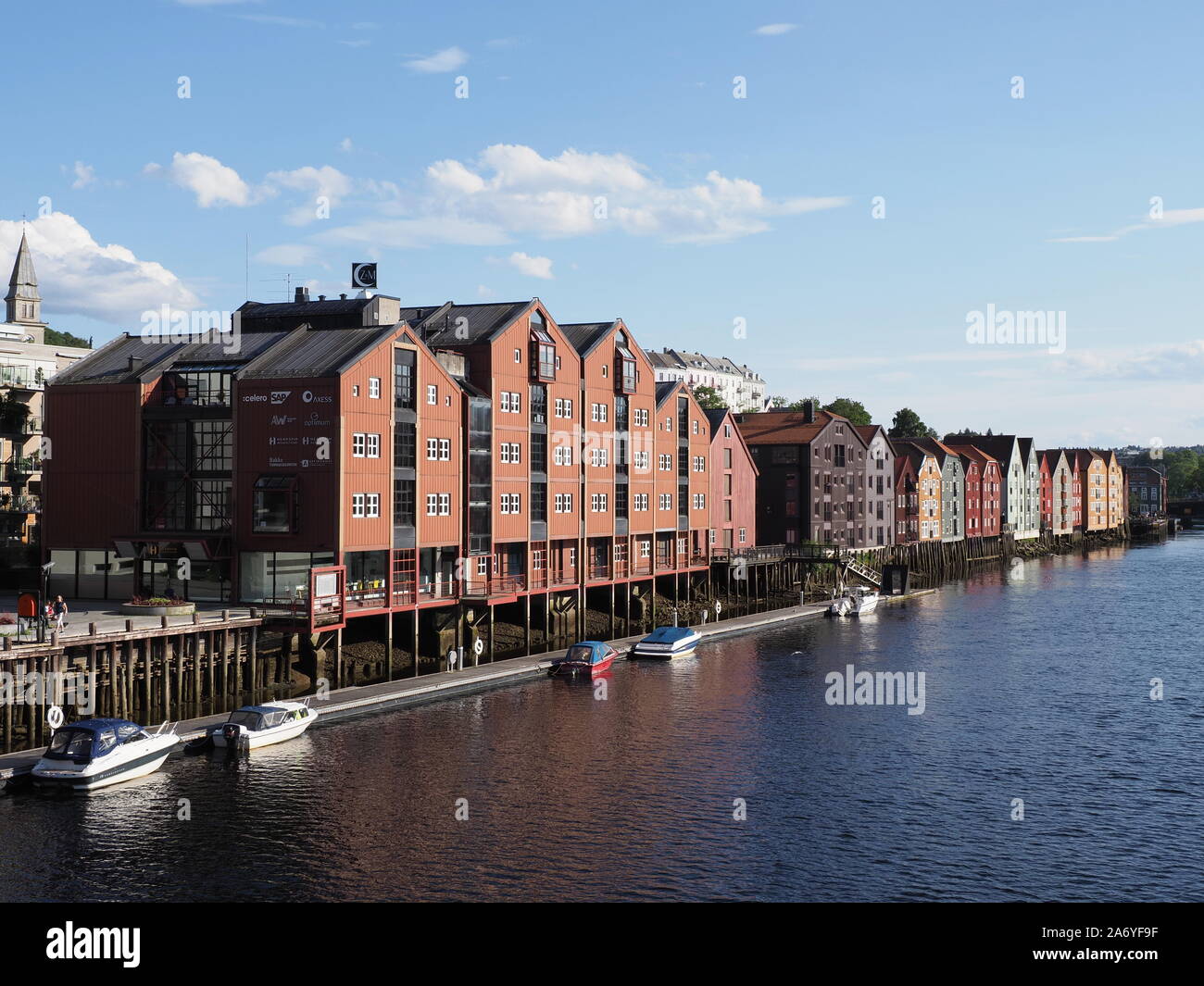 Harbor and colored houses at Nidelva river at Trondelag district in european Trondheim city in Norway Stock Photo