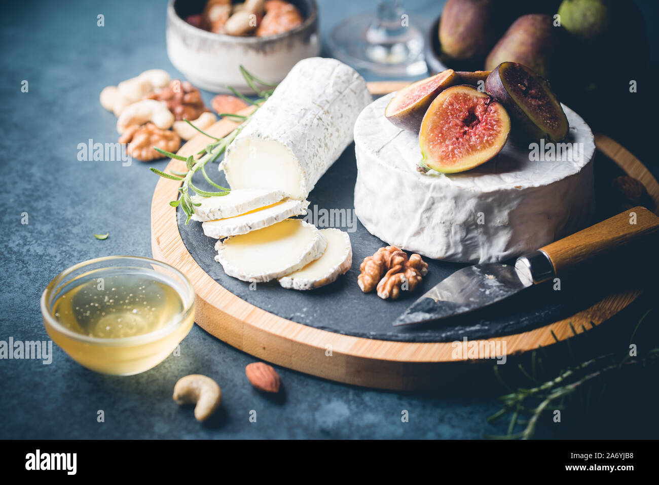 Fresh goat brie cheese with truffle and white mold on cheese platter