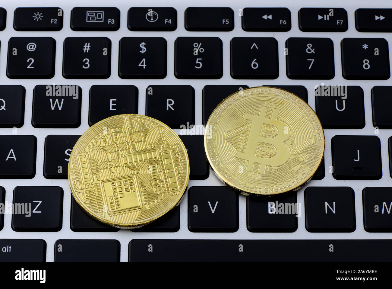 Bitcoin coins on laptop keyboard. Cryptocurrency. Selective focus - image Stock Photo