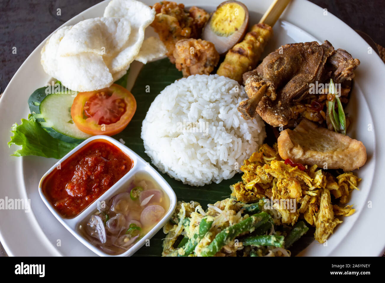 Nasi Campur Bali Bebek Betutu translate Balinese Mixed Duck Rice, Indonesian Balinese cuisine. Stock Photo