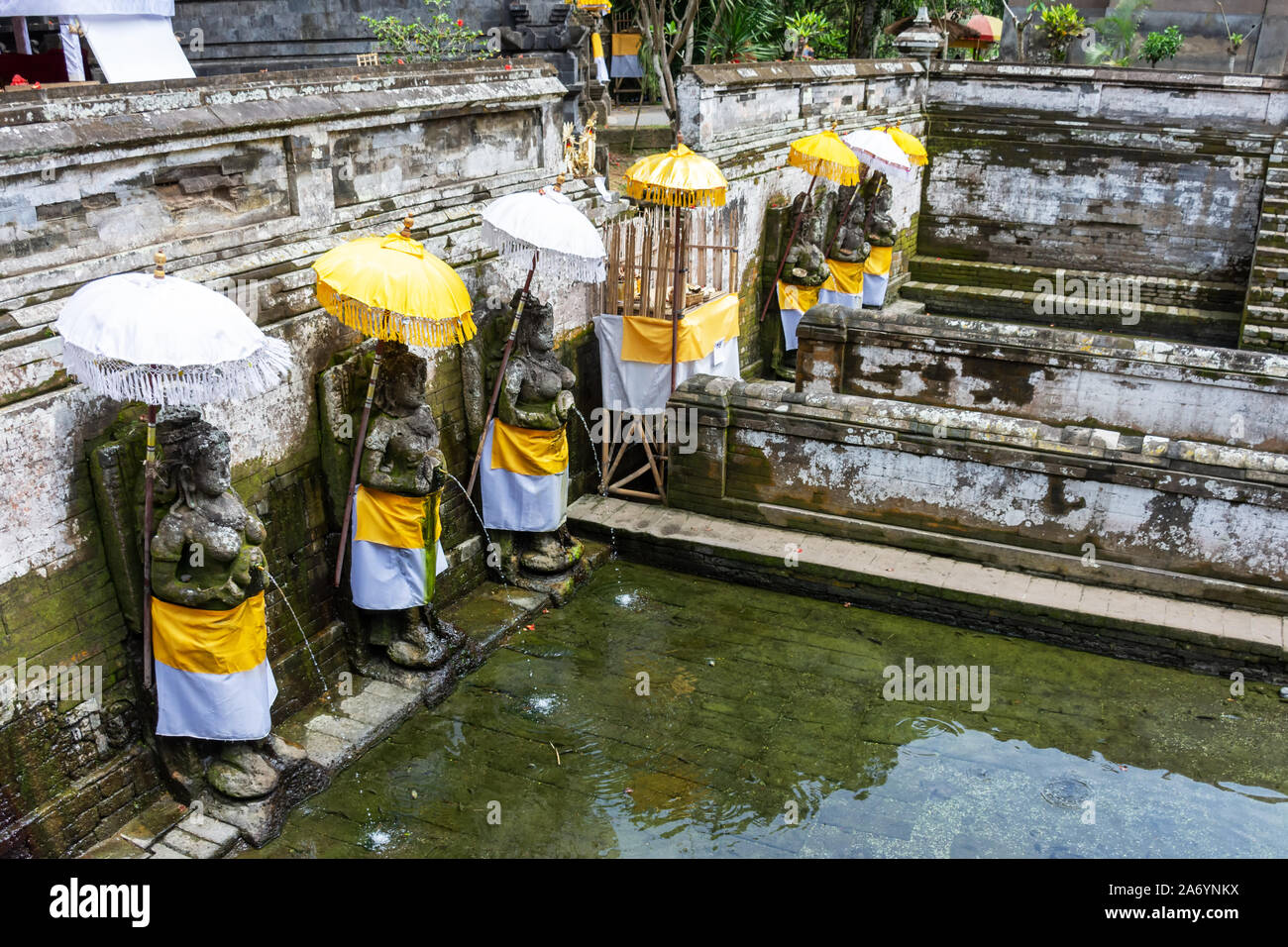 Holy spring water at Goa Gajah temple or also known as Elephant cave in Sukawati district Bali, Indonesia Stock Photo