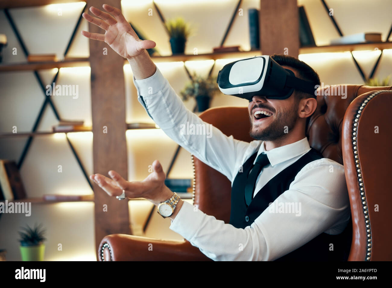 Man Using The Virtual Reality Man wearing virtual reality goggles. Future technology concept Stock ...