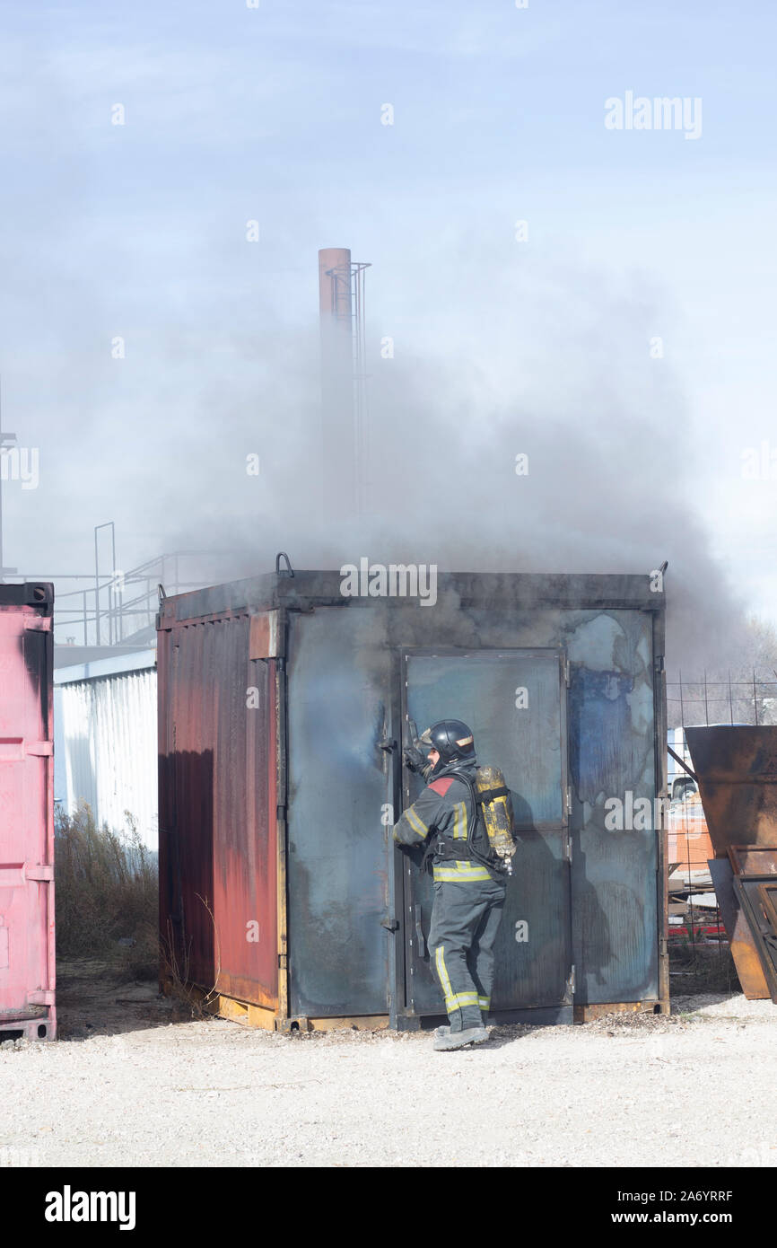 Firefighter putting out fire training station extinguisher backdraft ...
