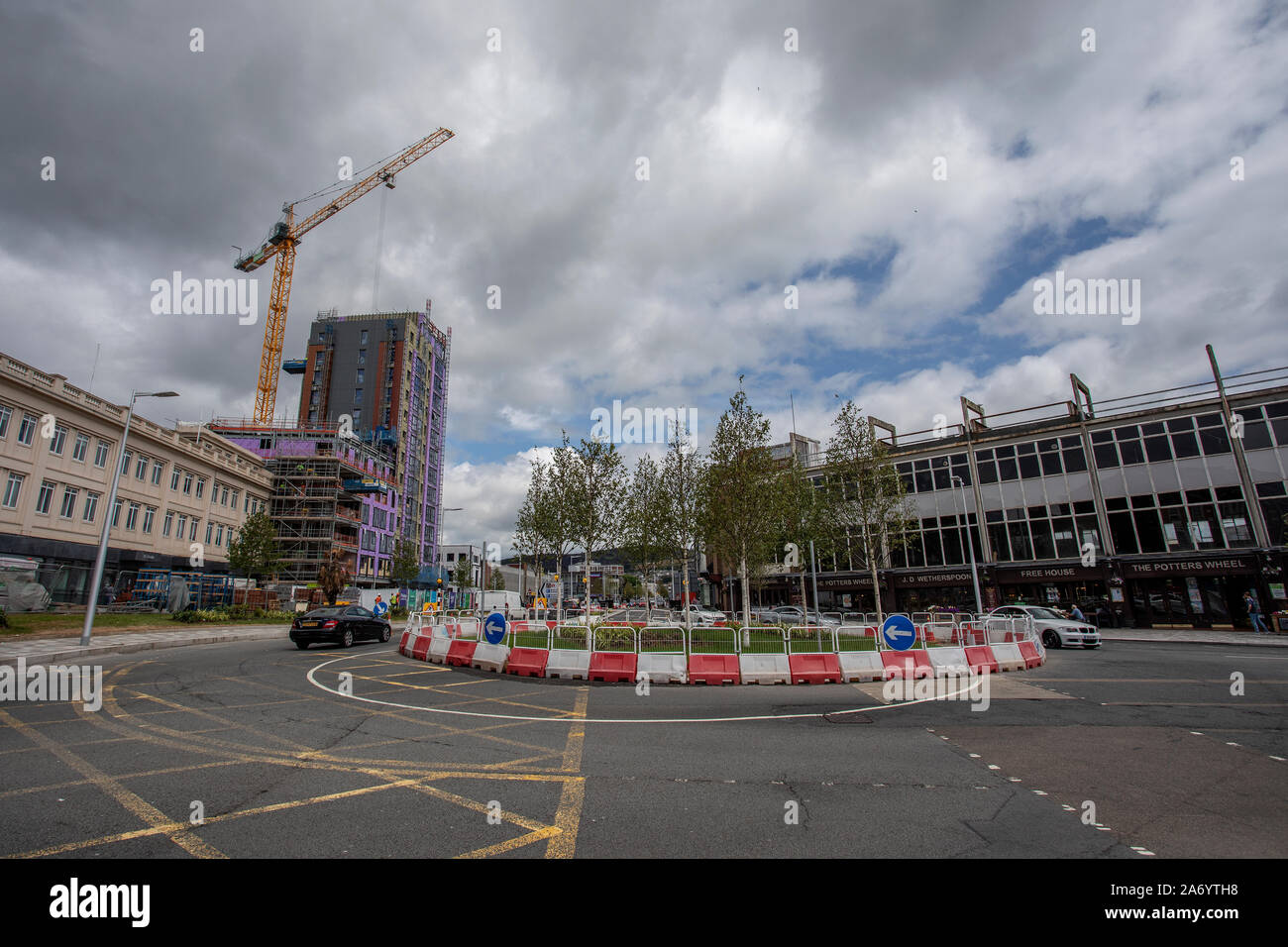 Pictured: A general view of road construction works on the Kingsway and the new Swansea student apartments being built in Swansea city centre, Wales, Stock Photo