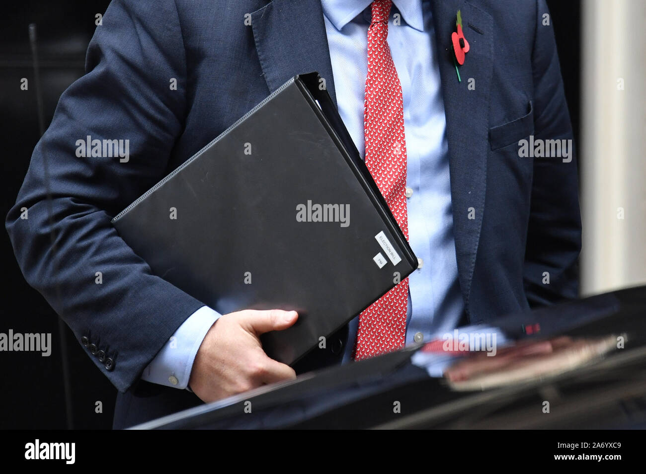 Prime Minister Boris Johnson leaves 10 Downing Street, London, carrying a folder labelled Election Bill. Stock Photo