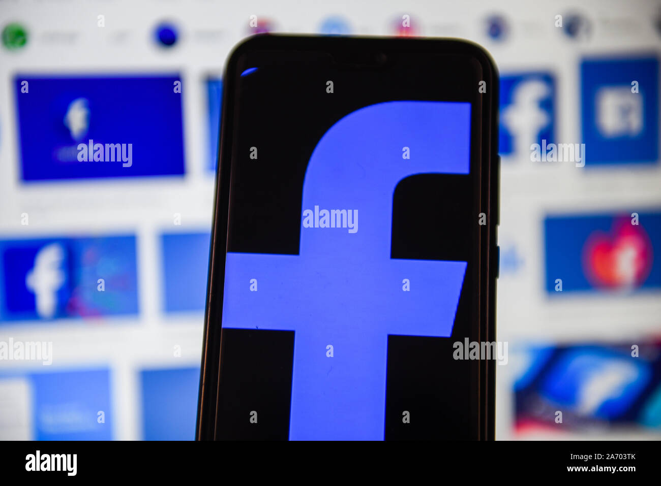 In this photo illustration a Facebook logo displayed on a smartphone ...