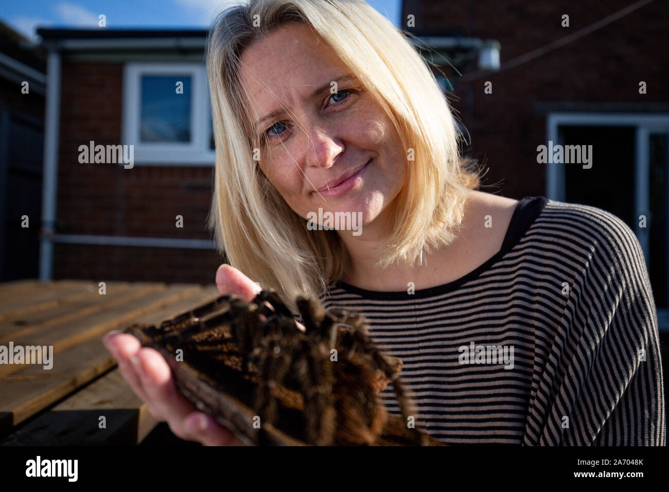 Zoologist Carrie Alcock with Zara, another of her birdeater spiders at her home in Cheadle, Staffordshire ahead of the National Pet Show at the NEC on November 2 and 3. PA Photo. Picture date: Tuesday October 29, 2019. Photo credit should read: Jacob King/PA Wire Stock Photo