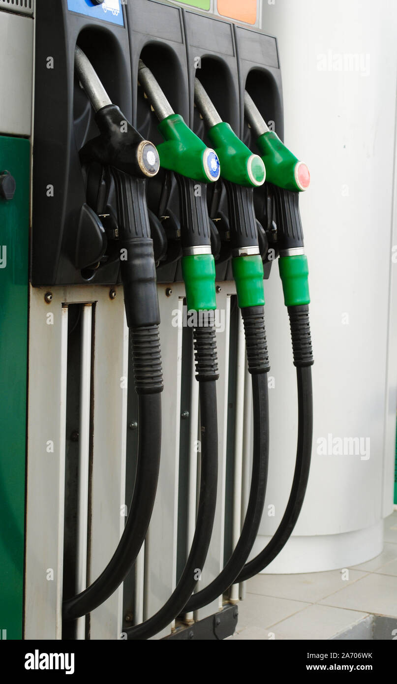 Gas station with three green handles and a black Stock Photo Alamy