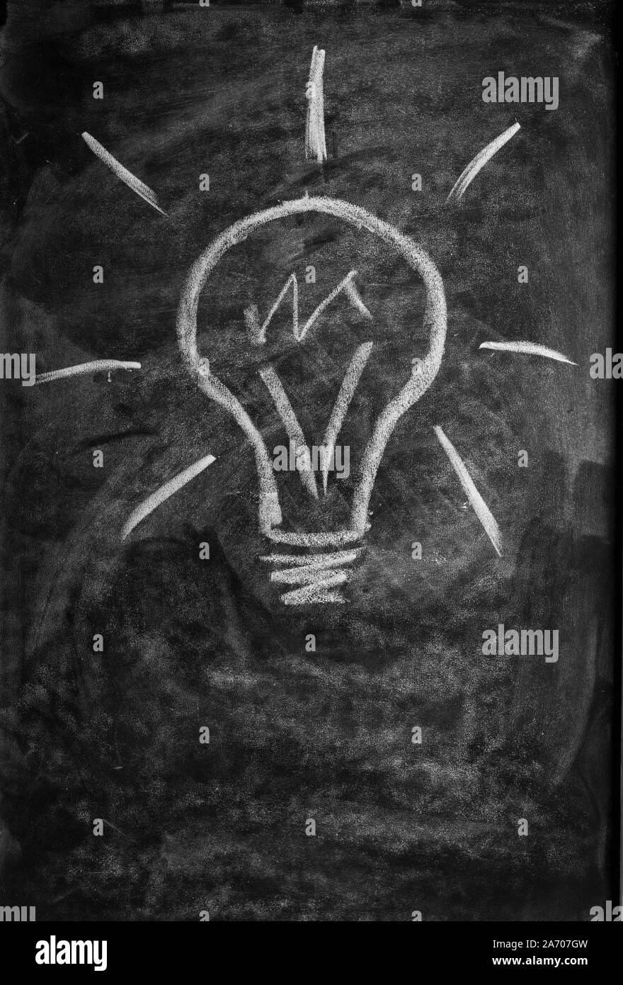 light bulb drawn with chalk on blackboard Stock Photo