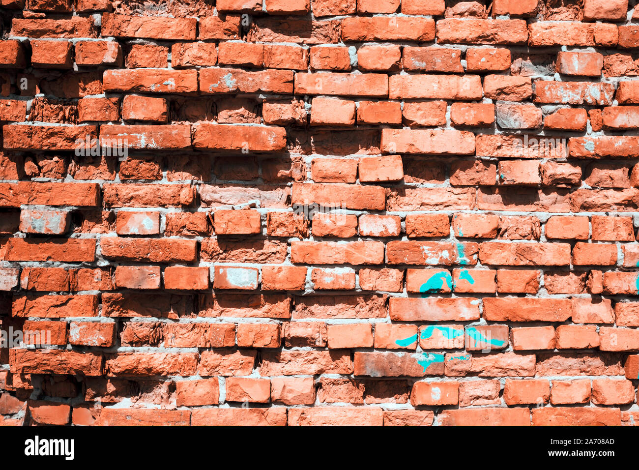 Grunge brick wall background with aging texture closeup Stock Photo