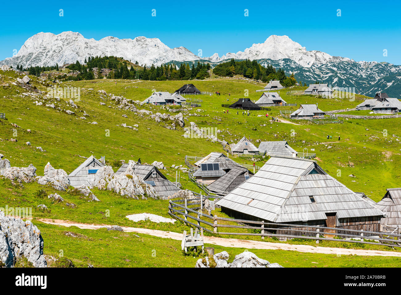 Big Pasture Plateau or Velika Planina in Slovenia. traditional Wooden Shepherd Shelters in Mountains. Stock Photo
