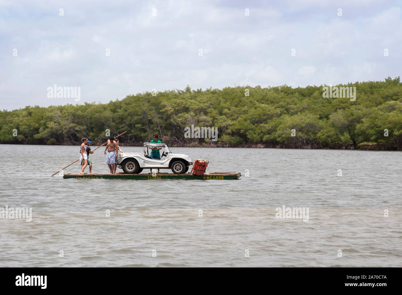 couple crossing the river with buggy by paddle boat in Brazil Stock Photo -  Alamy