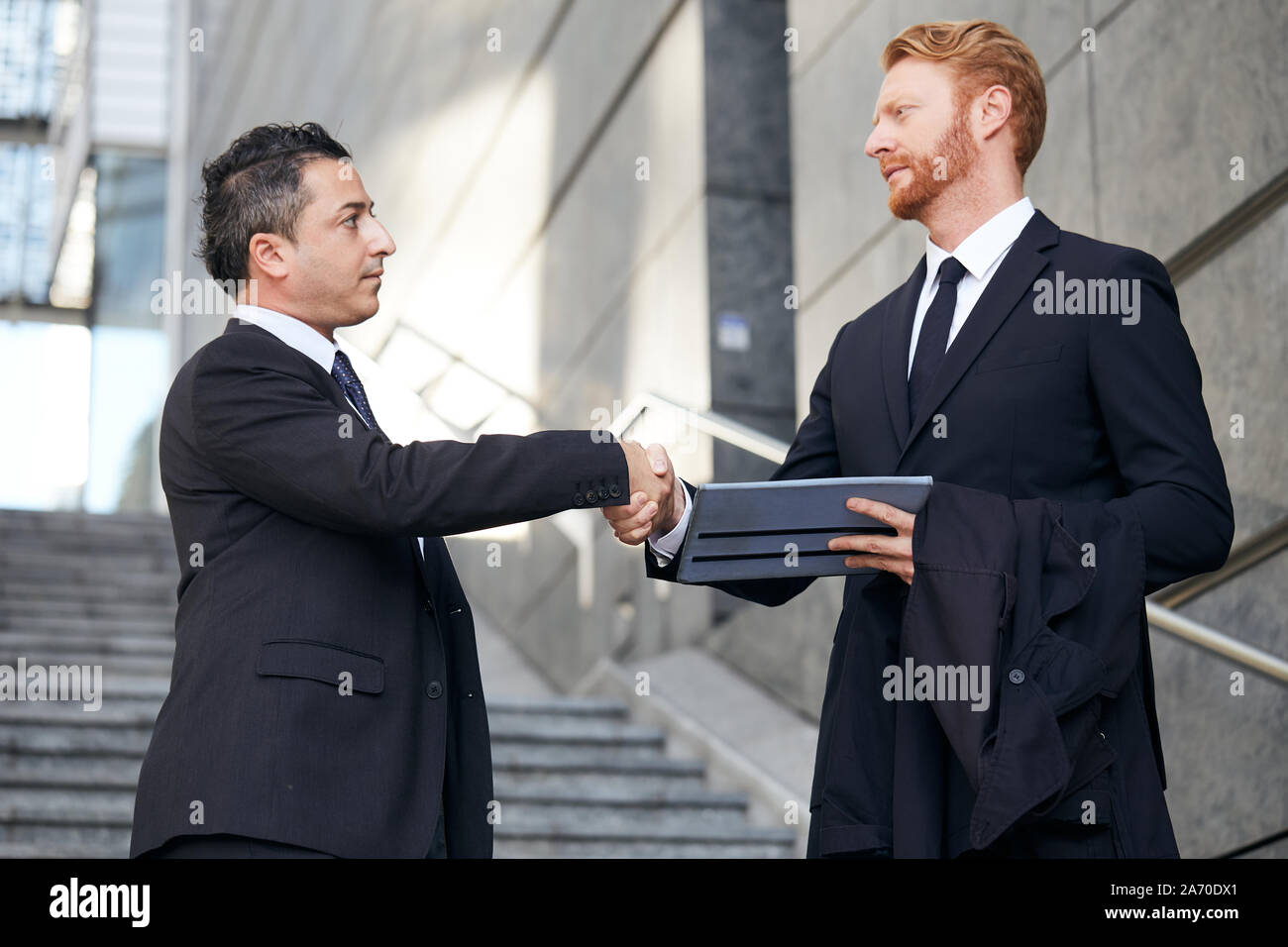 business people working outside office building Stock Photo - Alamy