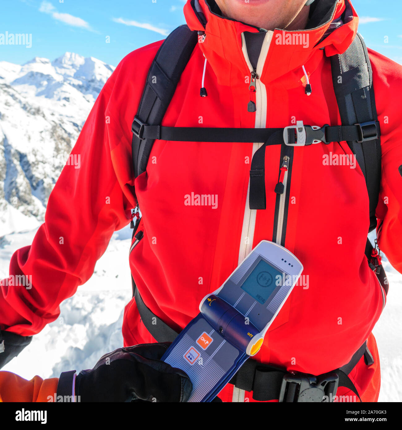 Mountain guide checking functionality of safety equipment Stock Photo