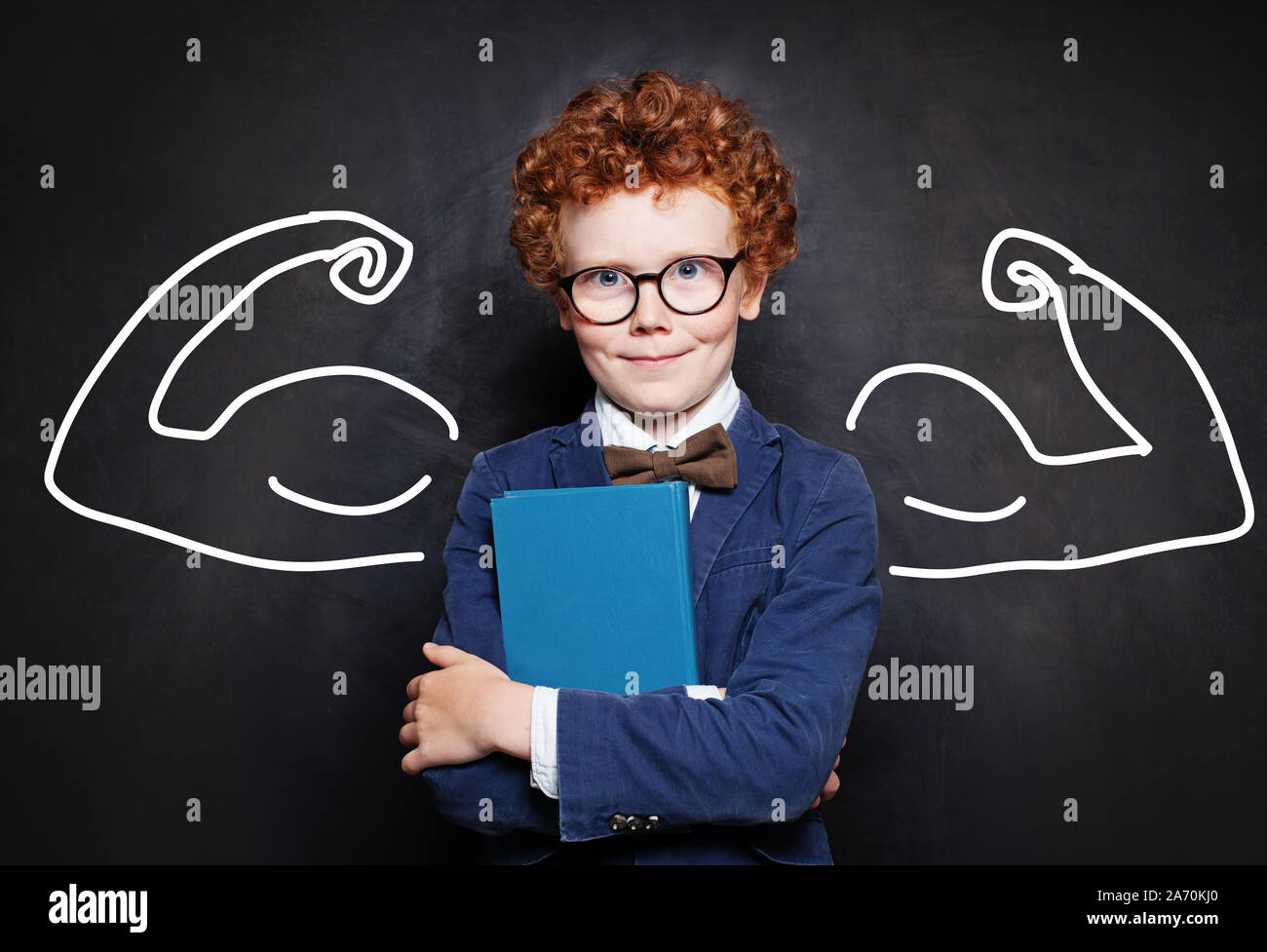 Redhead kid holding book with empty cover. Smart child boy Stock Photo