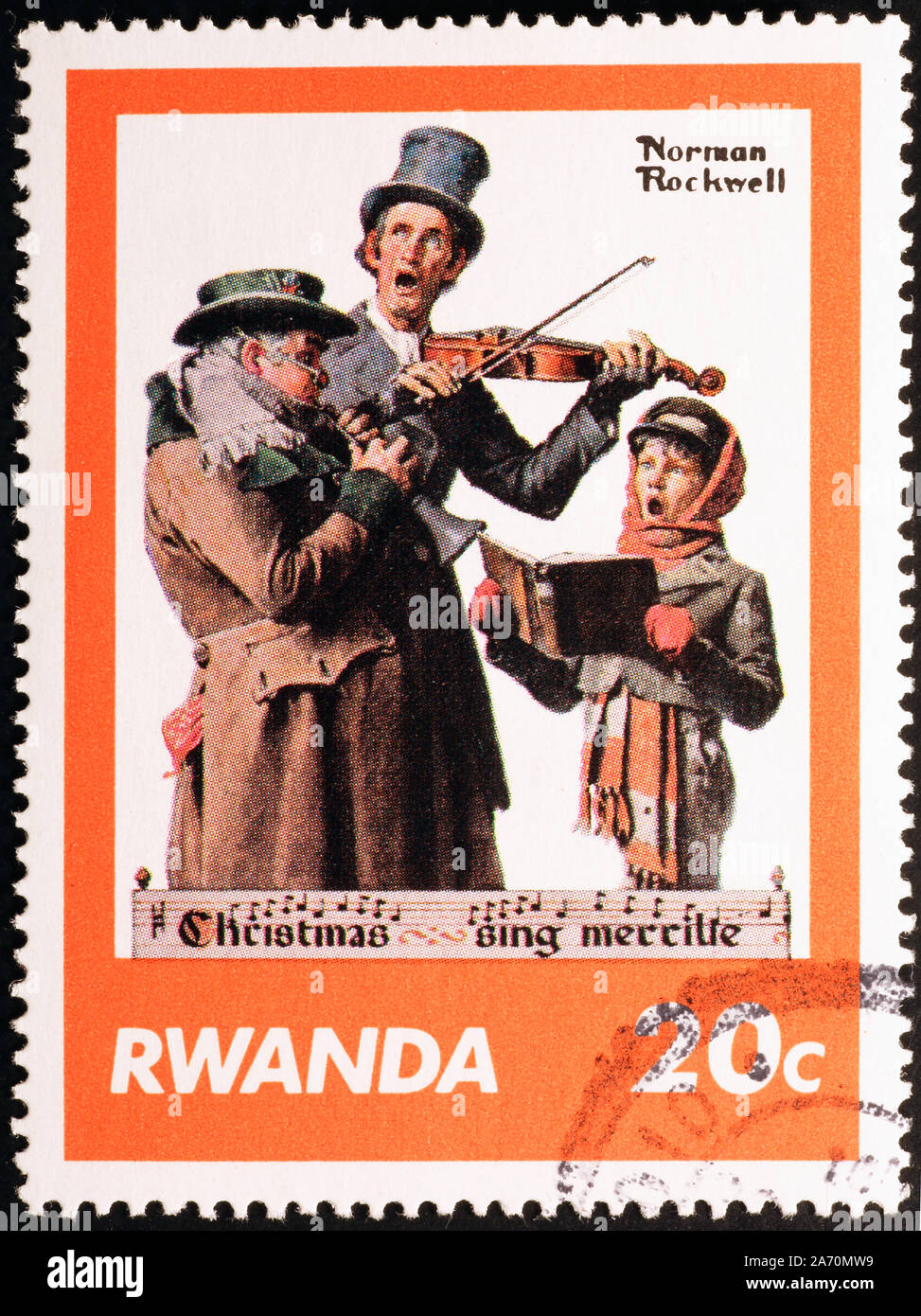 Christmas singers by Norman Rockwell on postage stamp Stock Photo